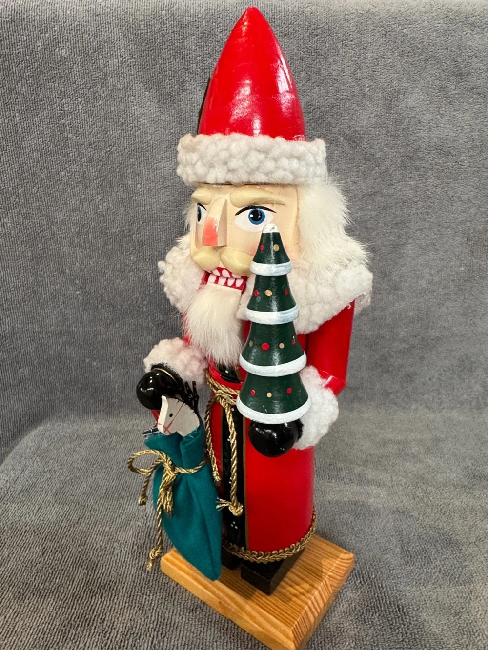 1990s 13.75 inch Santa Nutcracker with Green Tree and Sack of Toys Holiday Decor